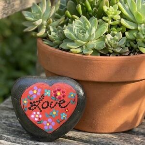 Hand crafted painted heart rock Love black stone dotted flowers floral pink red